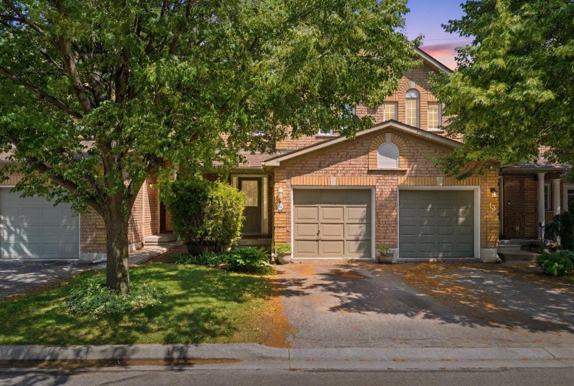 Brick townhome under a mature tree, Darien Road, Burlington